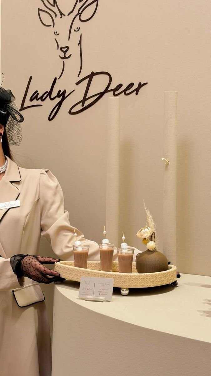Lady Deer hostess with welcome tray