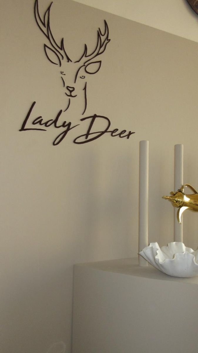 Lady Deer emblem on the boutique wall